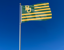 Load image into Gallery viewer, 3x5 foot wide Baylor University Flag with green &amp; gold USA flag style 13 stripes and two metal grommets attached to flagpole waving in the wind
