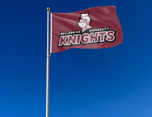 Maroon 3x5 foot wide Bellarmine University Flag with two metal grommets attached to flagpole waving in the wind