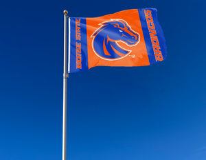 3 Panel Blue orange blue 3x5 foot wide Boise State University Broncos Flag with two metal grommets attached to flagpole waving in the wind